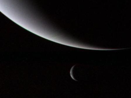 IMAGE TAKEN 3 DAYS AFTER FLYBY; TRITON IS THE SMALLER CRESCENT BELOW NEPTUNE.