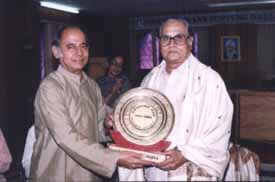 Poet Vaiththeesvaran: receiving awarad from Dr.K.S.Subramaniyam